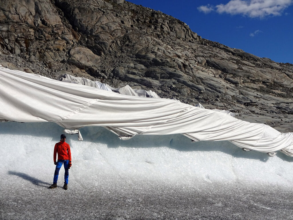 Bright fleece coverings protect the ice caves at Rhonegletscher through melt reduction, Source: Matthias Huss.